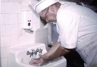 Food worker washing his hands