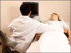 The table is too high, the chair too low, and the patient too far away.