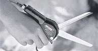 Spring loaded scissors relieve contact stress to the hand