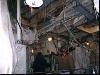 Flame-retardant protective covers on cabling to protect against hot work damage.