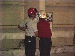 Fire department workers reviewing emergency escape plan.