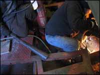 Fire watch with hotwork (sparks) in the back ground.