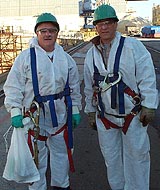 Figure 1: Workers equipped with full body harnesses, lanyards and oversized snaphooks