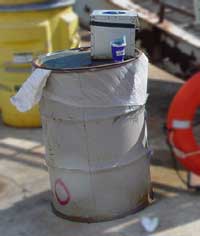 PFigure 1: PPE disposal barrel and hand wipe station