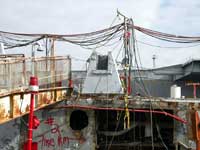 Figure 4: Metal trees used to elevate hoses and cables over gangway