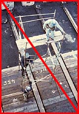 Figure 25: Improper practice - Workers exposed to falls from ladder and scaffold