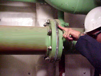 Figure 4: Marine Chemist verifies that piping is secured