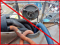 Figure 22:  Improper practice - Ventilation hoses extending into confined space to ensure safe conditions. (Improper practice if only access.)