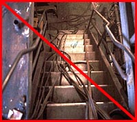 Figure 2: Improper practice - Stair exit route impeded by hoses and cables.