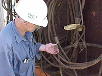 Figure 5: Worker inspecting wire rope slings