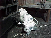 Figure 5: Painter with supplied air respirator