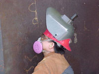 Figure 7: Welder with air-purifying respirator