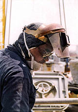 Figure 6: Worker with welding hood and safety glasses