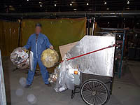 Figure 36: Worker removing trash from work area