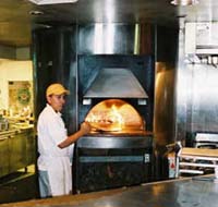 Working in front of a hot oven