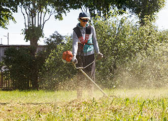 Parks and Recreation - young worker using a weed whacker | copyright:AigarsR - iStock.com:157986039 