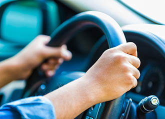 Safe Driving - person with hands on steering wheel | copyright: GCShutter - istock.com:586051472 