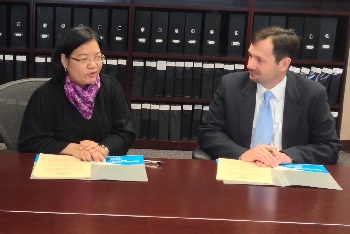 Consul General of the Philippines Maria Hellen Barber De La Vega and OSHA Deputy Regional Administrator Eric Harbin at March 10 signing ceremony.