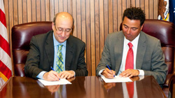 DOL photo by Fredde Lieberman - OSHA Assistant Secretary David Michaels and Eric Rodriguez, Vice President of Research, Advocacy and Legislation for the National Council of La Raza, sign an Alliance to protect the safety and health of vulnerable workers.