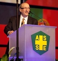 Dr. Michaels giving speech at podium