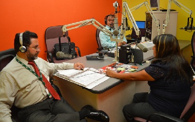 OSHA compliance officer Magnolia Torres and Carlos Giralt Cabrales discuss OSHA's heat and fall prevention campaigns on Spanish-language Radio Unika.