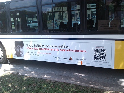 Dallas bus with OSHA fall prevention campaign poster
