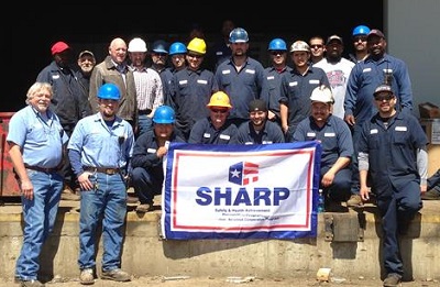 Becker Iron and Metal Inc. with SHARP banner