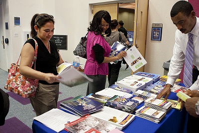 Attendees at the Las Vegas forum peruse OSHA publications on Preventing Heat Illness in Outdoor Workers and the Dangers of Formaldehyde in Hair Smoothing Products.