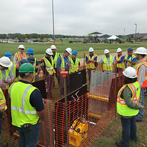 Trainers demonstrate the proper use of hydraulic shoring and shielding equipment.