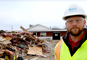 Photograph of a worker at a flood zone