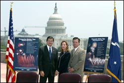 (left to right) OSHA's then-Assistant Secretary John Henshaw, APA's Executive Director, Julie Heckman, and APA President Michael Collar pose with OSHA/APA Alliance-developed Fireworks Safety Posters after the signing ceremony.