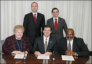 (seated left to right) BSCAI Executive Vice President, Carol A. Dean, OSHA's then-Assistant Secretary, John Henshaw and BSCAI President, LeRoy Dock pose with BSCAI Legal Council for Government Affairs, Michael McNamara (left) and Michael Zolandz from Sonnenschein, Nath and Rosenthal LLP.