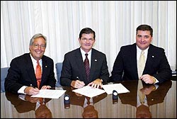 (L-R) Bruce D'Agostino, Executive Director, CMAA; OSHA's then-Assistant Secretary, John Henshaw and Ted Devens, CMAA, sign an Alliance renewal on July 28, 2004. 