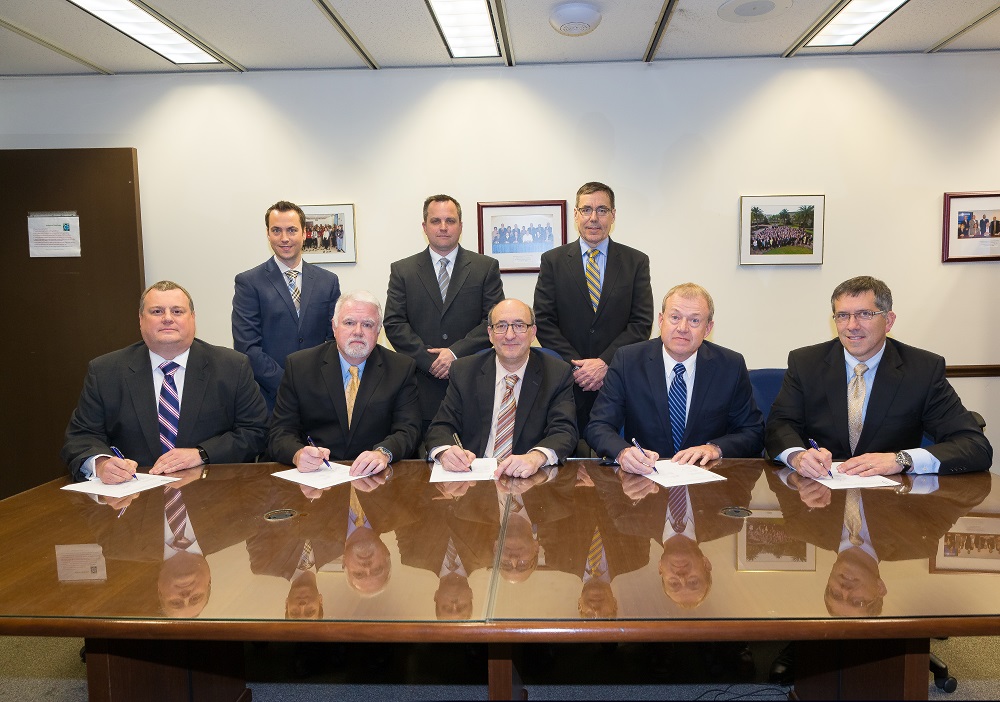 then-Assistant Secretary Dr. David Michaels (seated center) with representatives of the CHM Alliance at the Alliance renewal ceremony on February 2, 2016.