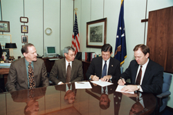 From L-R: The Dow Chemical Company's Mark Spence and Bart Gliatta watch while OSHA's then-Assistant Secretary, John Henshaw, and Dow's Sam Smolik sign their Alliance