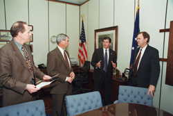 OSHA's then-Assistant Secretary, John Henshaw, speaks with The Dow Chemical Company representatives. From L-R: Mark Spence, Bart Gliatta and Sam Smolik
