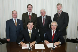 OSHA's then-Assistant Secretary, John Henshaw, and HPS members at national Alliance signing.
