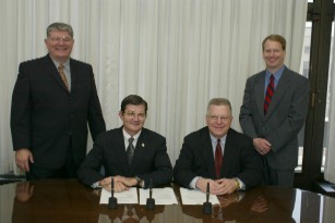 (L-R) John Elmore, Chair, NHCA - OSHA Liaison Committee, OSHA's then-Assistant Secretary John Henshaw, Tim Bailey, NHCA President, and Ted Madison, NHCA President-Elect following the signing of the OSHA/NHCA Alliance.