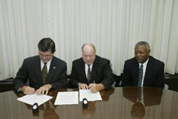 OSHA's then-Assistant Secretary of Labor, John Henshaw; James J. Thatcher, President and Mr. Roosevelt Smith, First Vice President, National Safety Management Society sign national Alliance on October 1, 2003.