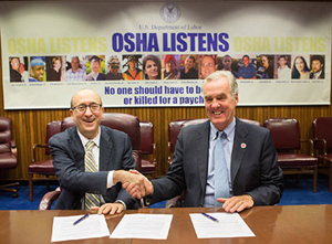 then-Assistant Secretary Dr. David Michaels, USDOL-OSHA and J.A. McMaster, President, Preparedness and Health and Safety Services, American Red Cross, at the alliance renewal signing on November 9, 2015.