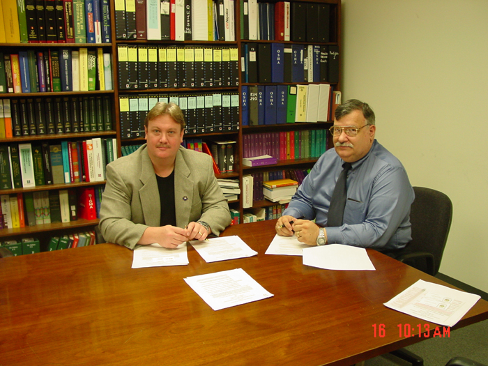Rocco C. Galo, International Brotherhood of Teamsters - Local 1150 and Robert Kowalski, Bridgeport Area Office Director sign an Alliance on September 16, 2003.