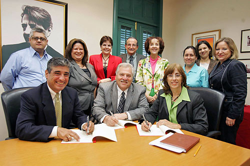 (Seated L to R) Jose Carpena, Area Director, Region II, Puerto Rico Area Office, USDOL-OSHA; Louis Ricca, Jr., Acting Regional Administrator, Region II, USDOL-OSHA; Sonia Balet, Acting Chancellor, University of Puerto Rico, Rio Piedras Campus . (Standing L to R) Jorge Ramos, Director, Oficina de Protecci&oacute;n Ambiental y Salud Ocupacional or, in English, Environmental Protection and Occupational Safety Office; Lymari Orellana, Alliance Coordinator, Region II, Puerto Rico Area Office, USDOL-OSHA; Rosa M. Oliveras, Director Multidiscipline's, Divisi&oacute;n de Educaci&oacute;n Continuada y Estudios Profesionales, (DECEP); Carlos F. Rosado, Director, DECEP; Nitza Melendez, Director, Labor Relationships Institute; Migdalia Ruiz, Professor, DECEP; Daphne Dominguez, Special Aide to Chancellor, University of Puerto Rico, Rio Piedras Campus; and Carmen D. Suarez, Special Aide to Chancellor, University of Puerto Rico, Rio Piedras Campus.
