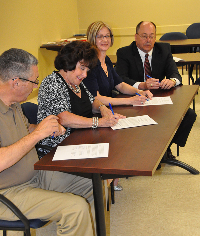 Fred Eysaldt, OSHA Supervisor; Marie Wright, ABC Delaware Safety, Health & Wellness Committee Chair; Erin Patterson, OSHA Area Director; and Ed Capodanno, ABC Delaware President; at the alliance signing ceremony on June 15, 2016.