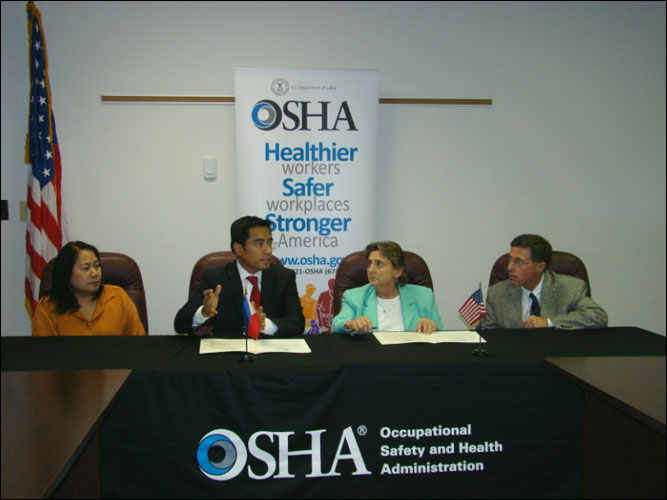 (L to R) Renell Martinez, Collecting Officer, Philippines; Ariel Penaranda, Consul General, Philippines; Teresa Harrison, Acting Regional Administrator, Atlanta, Georgia, USDOL-OSHA; and Bill Fulcher, Area Director, Atlanta-East, Georgia Area Office, USDOL-OSHA, sign the OSHA and Consular of the Philippines in Washington, DC-Georgia and Alabama Area Alliance on November 1, 2013.