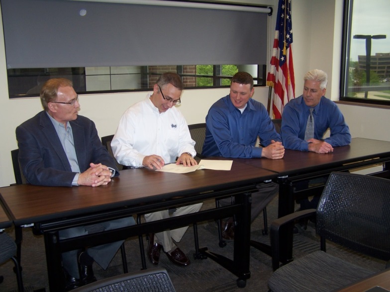 Photo depicting renewal of the Cleveland Safety Forum Alliance on 5/23/2014. From left to right: Don Mays (Co-Chair Cleveland Safety Forum), Bill Hocevar (Co-Chair Cleveland Safety Forum), Kent Crytzer (Co-Chair Cleveland Safety Forum), Howard Eberts (Cleveland OSHA Area Director)