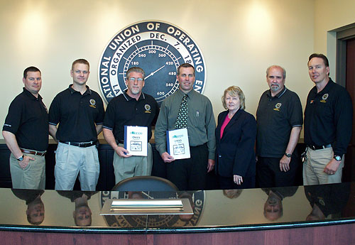 (L to R) Mike Drew, Instructor, Apprenticeship Skill Improvement Program, Operating Engineers, Local 150; Martin Turek, Assistant Coordinator/Safety Administrator, Apprenticeship Skill Improvement Program, Operating Engineers, Local 150; Mike Rorex, Coordinator/Administrator, Apprenticeship Skill Improvement Program, Operating Engineers, Local 150; Jim Martineck, Assistant Area Director, Region V, Calumet City, Illinois Area Office, USDOL-OSHA; Diane Turek, Area Director, Region V, Chicago North, Illinois Area Office, USDOL-OSHA; John Rickert, Safety Coordinator, Apprenticeship Skill Improvement Program, Operating Engineers, Local 150; Tom Spangler, Safety Coordinator, Apprenticeship Skill Improvement Program Operating Engineers, Local 150.