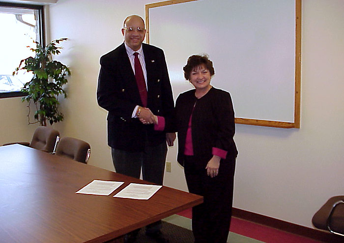 Jule Jones, OSHA's Region V Toledo, Ohio Office Area Director and Dennis McMickens, President of the Safety Council of Northwest Ohio, pose after signing the Alliance agreement.