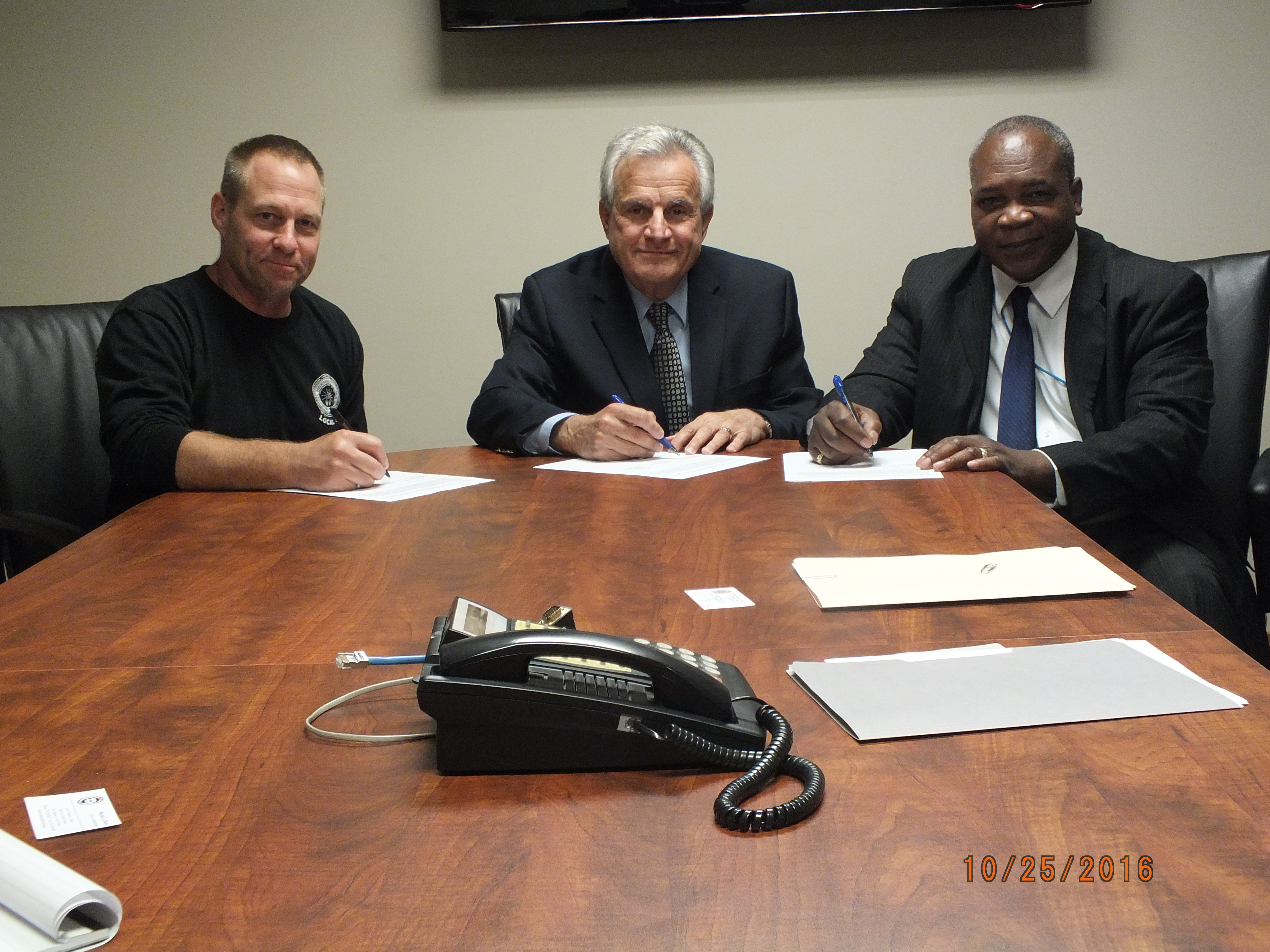 From left to right: Mike Sawyer, Assistant Business Manager, International Brotherhood of Electrical Workers, Local 55; Michael A. Mauro, Iowa Labor Commissioner; and Larry Davidson, Area Director for the OSHA Des Moines Area Office.
