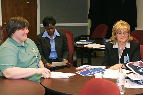 L-R: Natalie Schoonover, Staff Member, Coordinating Committee of Automotive Repair (CCAR); Terry Bradshaw-Morris, Program Analyst, Office of Small Business, Directorate of Cooperative and State Programs, OSHA-USDOL; and Stephanie Salmon, Member, 10-Q Committee, American Foundry Society (AFS); review OSHA's Introduction to OSHA for Small Businesses Short Course.