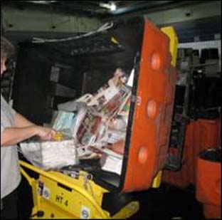 After - Container tilter lifts and tilts the hamper resulting in less bending and reaching